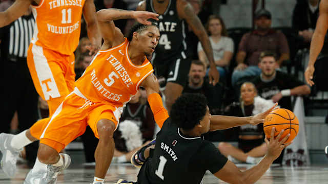 Jan 17, 2023; Starkville, Mississippi, USA; Mississippi State Bulldogs forward Tolu Smith (1) passes the ball as Tennessee Volunteers guard Zakai Zeigler (5) defends during the first half at Humphrey Coliseum. Mandatory Credit: Petre Thomas-USA TODAY Sports